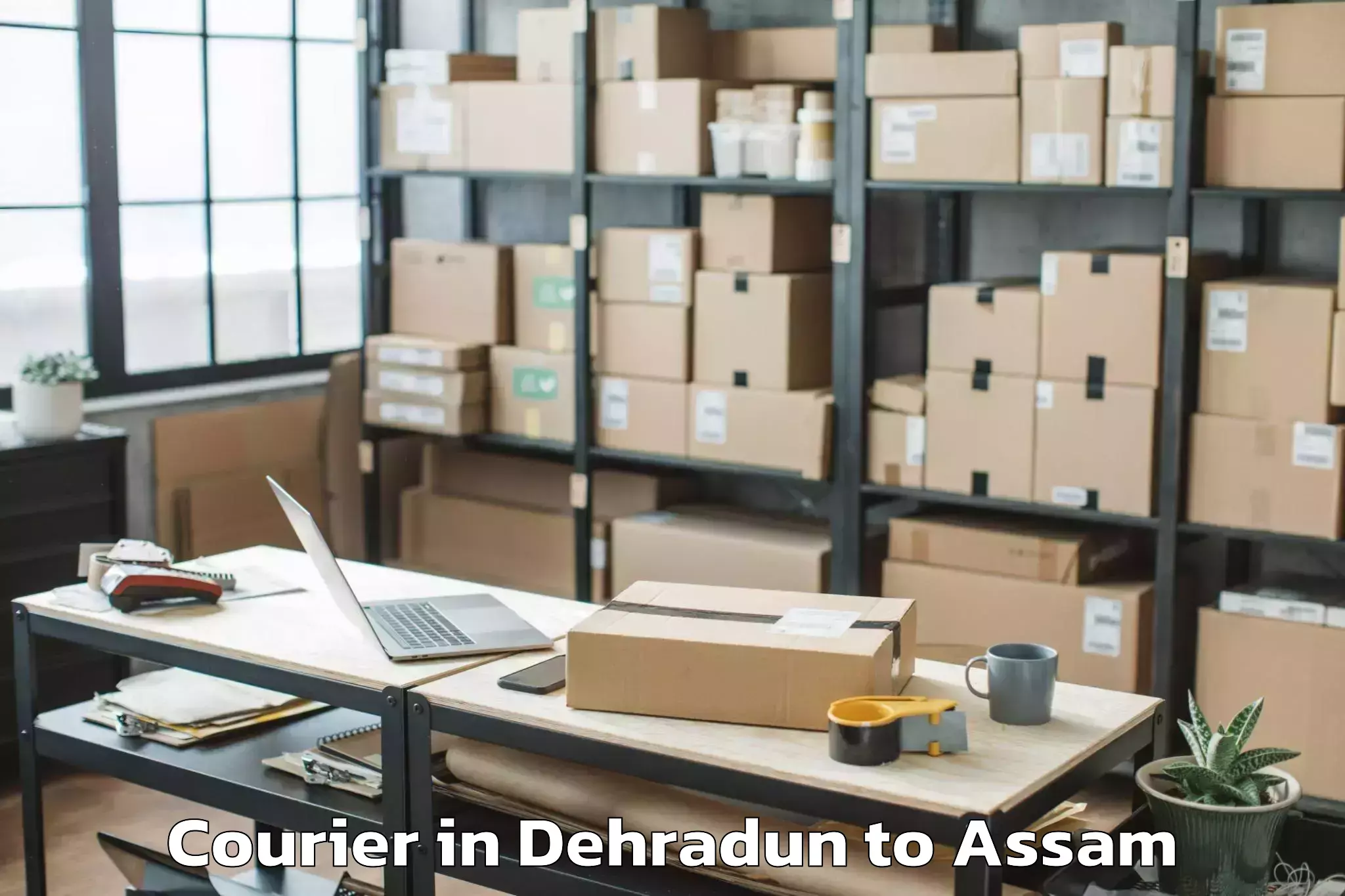 Book Your Dehradun to Makum Courier Today